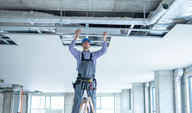 technician working on a commercial space's Ventilation system